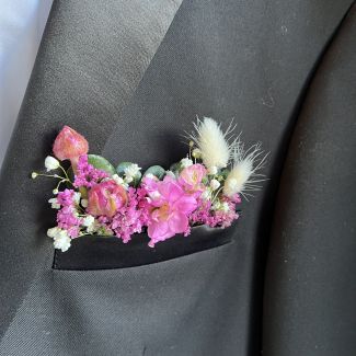 Fuchsia pocket boutonniere 
